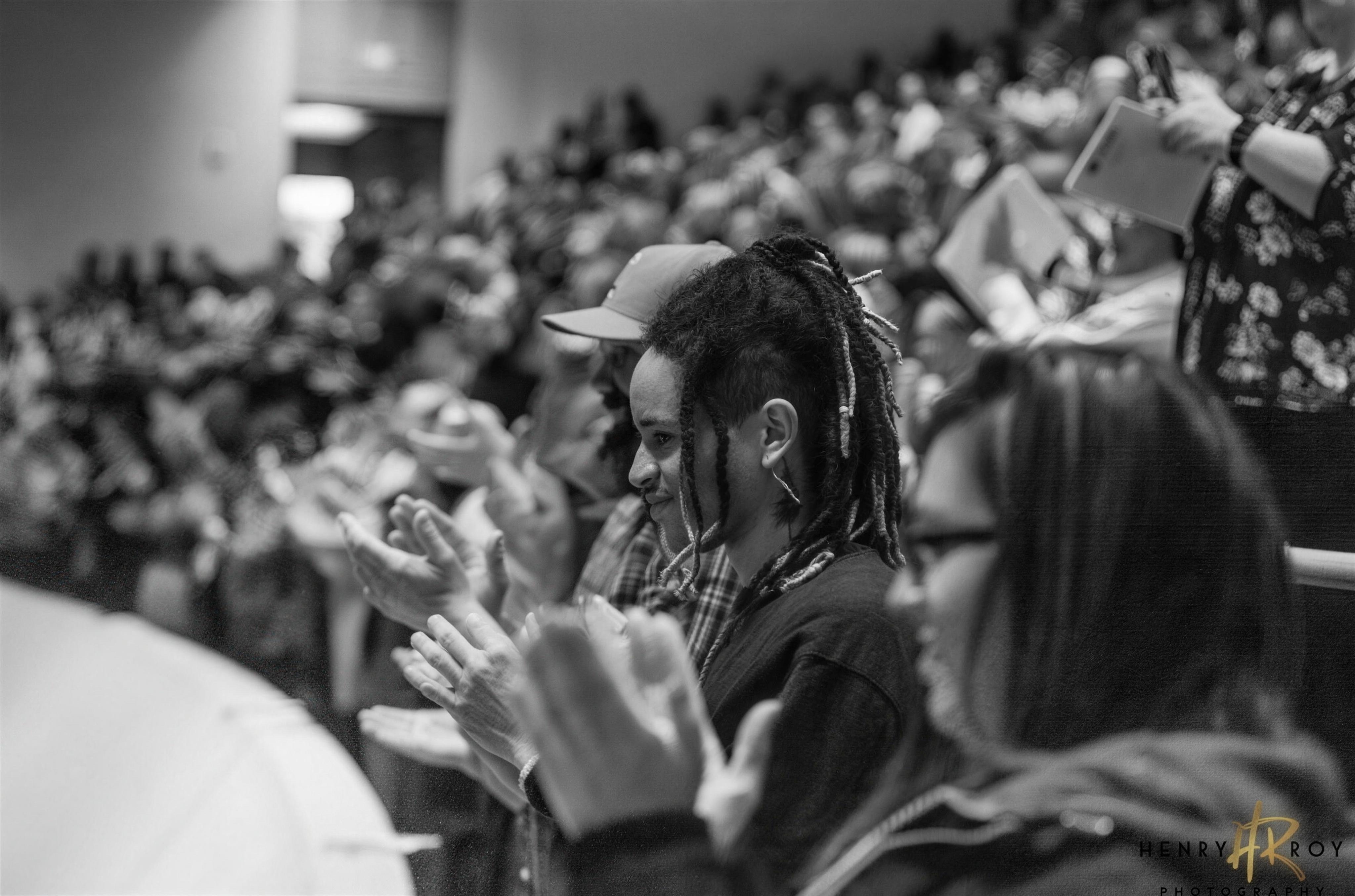 Audience members applauding